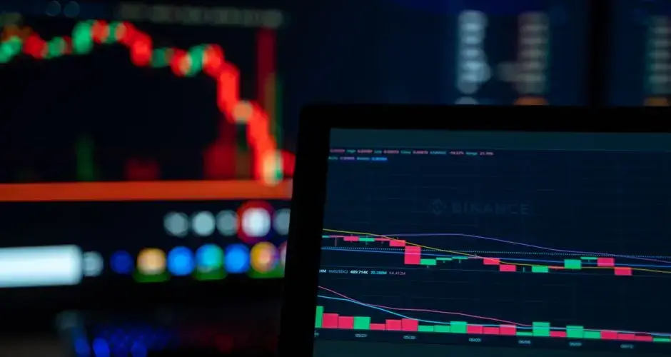 Bright trading screens depict cryptocurrency market trends in a tech setup.