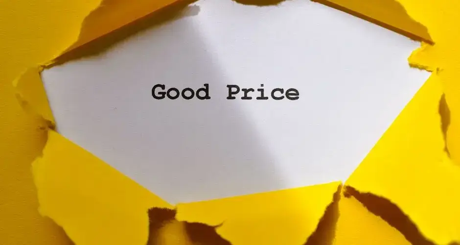 Yellow paper torn to reveal 'Good Price'. Perfect for sales and marketing concepts.